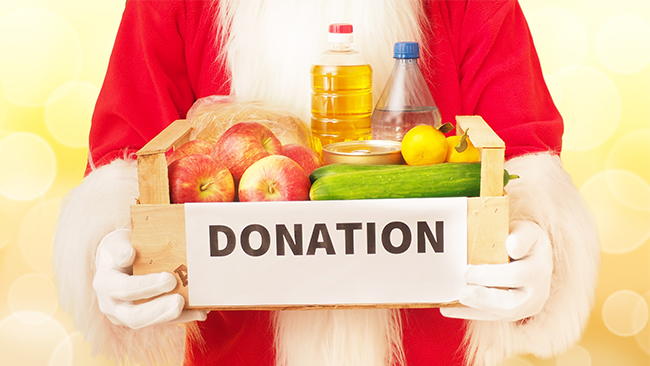 santa holding Christmas charity dontaion box